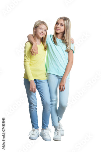 Full length portrait of cute girls in casual clothing posing on white background © aletia2011