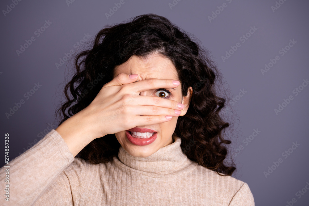 Close-up portrait of her she nice attractive pretty charming cute nervous terrified girlish wavy-haired lady prying hiding behind palm fingers isolated over gray violet purple pastel background - obrazy, fototapety, plakaty 