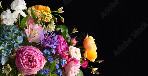 Canvas Print Beautiful bunch of colorful flowers on black background