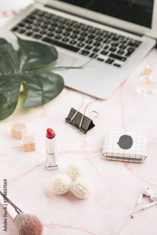 Office desktop with a lipstick Office desktop with a lipstick