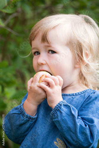 little white girl eating apple closeup face view