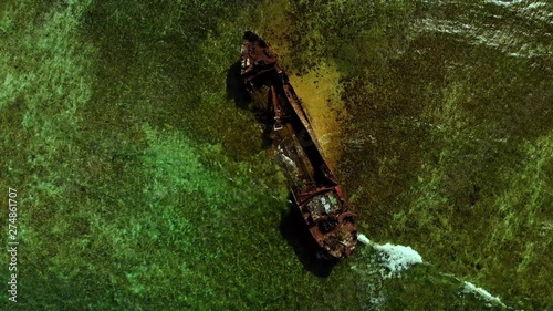 Amazing bird's eye view of a shipwreck embedded in the sand on a reef near the Caribbean island of Carriacou photo