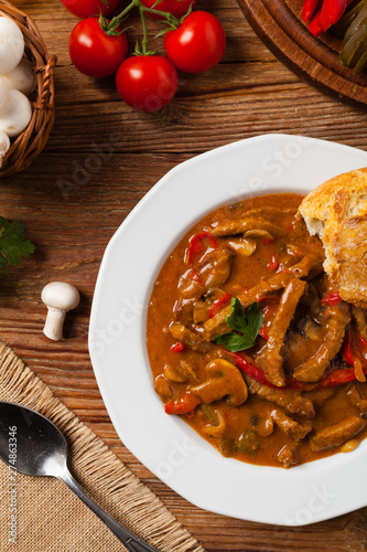 Boeuf, Stroganow, Strogonow. Classic, Russian beef stew. Served on a white plate. Top view. Natural background. photo