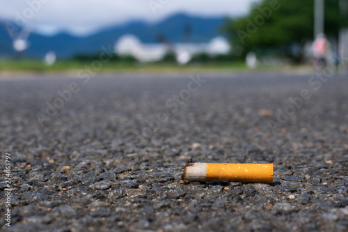 Cigarette littered on sidewalk