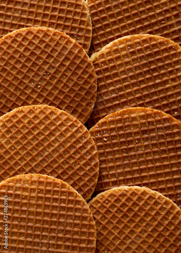 Sweet homemade dutch stroopwafels with honey-caramel filling, top view. Flat lay, overhead, from above. Close-up. photo