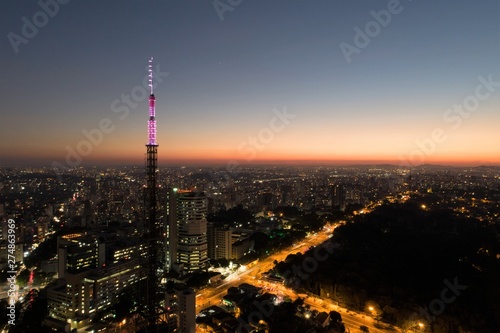 Sunset aerial view in São Paulo, Brazil. Great landscape. Explosion of colors on skyline. Business travel. Travel destination. © ByDroneVideos