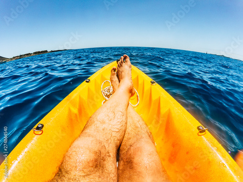 Fotografie Total lifestyle relax and desconnection concept with men legs in point of view o