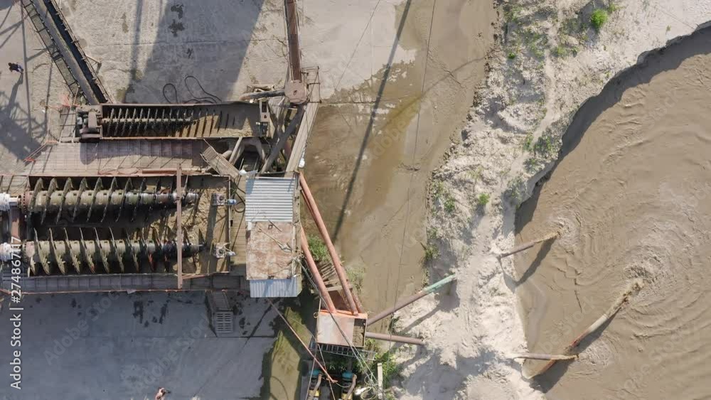 Top view of mining installation working on sand quarry. Sand mining industry. Top view of mining installation working on sand quarry. Sand mining industry.