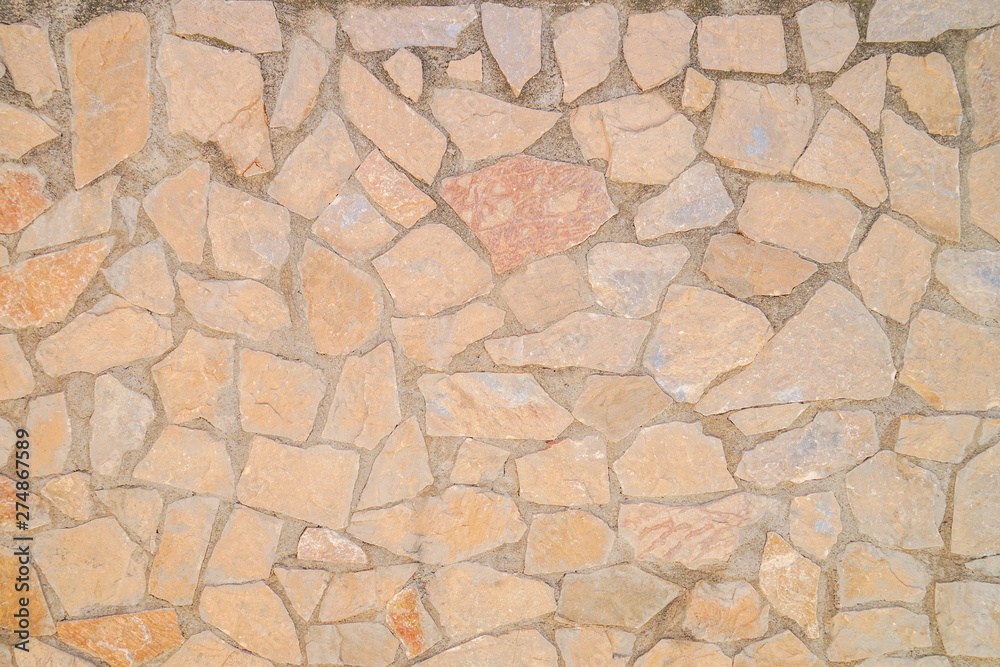 Obraz premium Masonry wall of stones with irregular pattern texture background