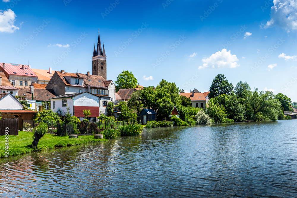 View of Telc across pond with reflections, Unesco world heritage site, South Moravia, Czech Republic.