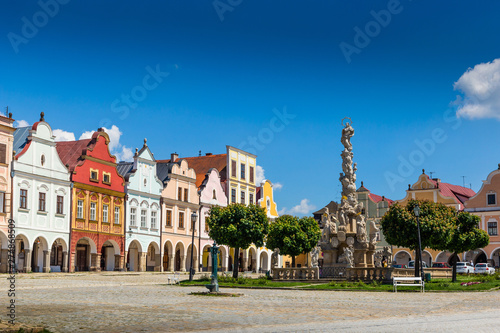 Main square of Telc city, a UNESCO World Heritage Site, on a sunny day with blue sky and clouds, South Moravia, Czech Republic.