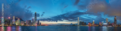 Photography Panorama of Skyline and harbor of Hong Kong city at dusk