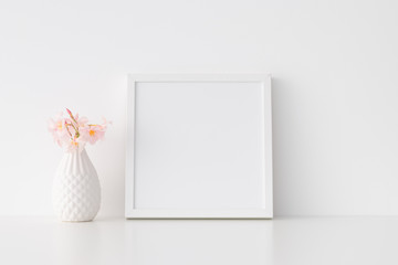 White square frame mockup with pink oleander in a vase.