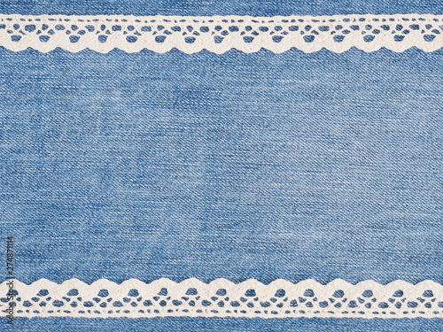 White lace on jeans background. Sewing still life photo
