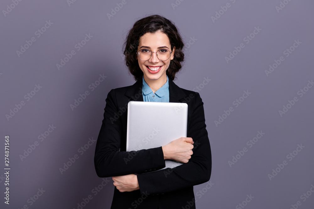 Portrait of cute pretty millennial hold hand netbook device gadget freelancer dressed clasy black jacket blazer wavy curly hairstyle isolated grey background Portrait of cute pretty millennial hold hand netbook device gadget freelancer dressed clasy black jacket blazer wavy curly hairstyle isolated grey background