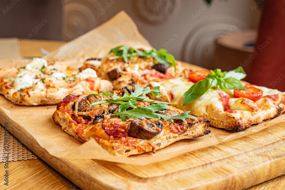 slice of italian pizza in the pizzeria slice of italian pizza in the pizzeria