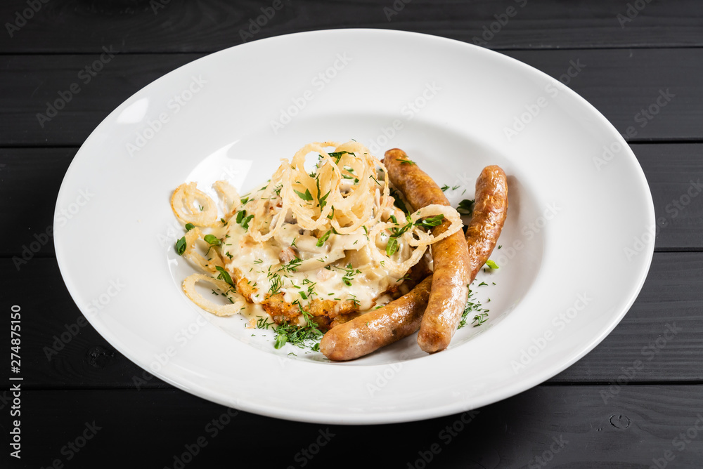 potato pancakes with sausages and fried onion potato pancakes with sausages and fried onion