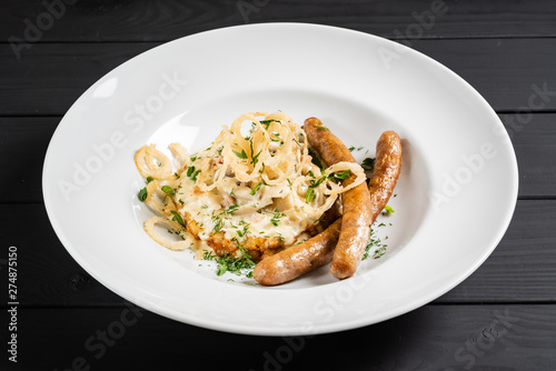 potato pancakes with sausages and fried onion