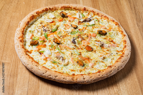 italian pizza on the wooden background