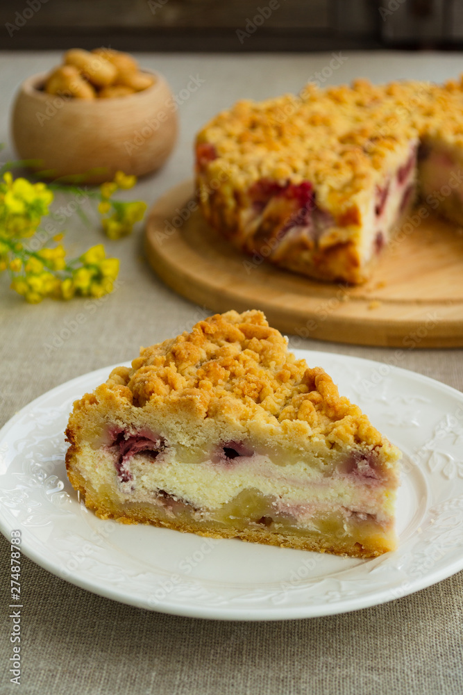 Pie with berries. Sweet homemade cake stuffed with cream cheese and strawberries. Closeup, rustic style.