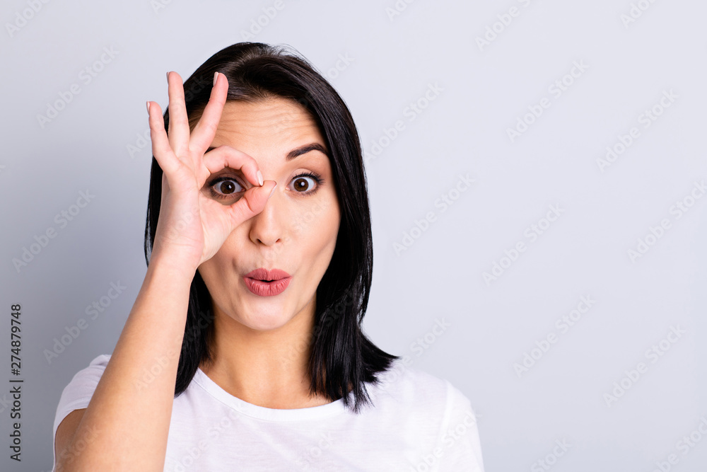 Close up photo beautiful amazing she her lady hand arm okey symbol near eye specs shape form figure perfect ideal appearance cheerful wear casual white t-shirt isolated bright grey background Close up photo beautiful amazing she her lady hand arm okey symbol near eye specs shape form figure perfect ideal appearance cheerful wear casual white t-shirt isolated bright grey background
