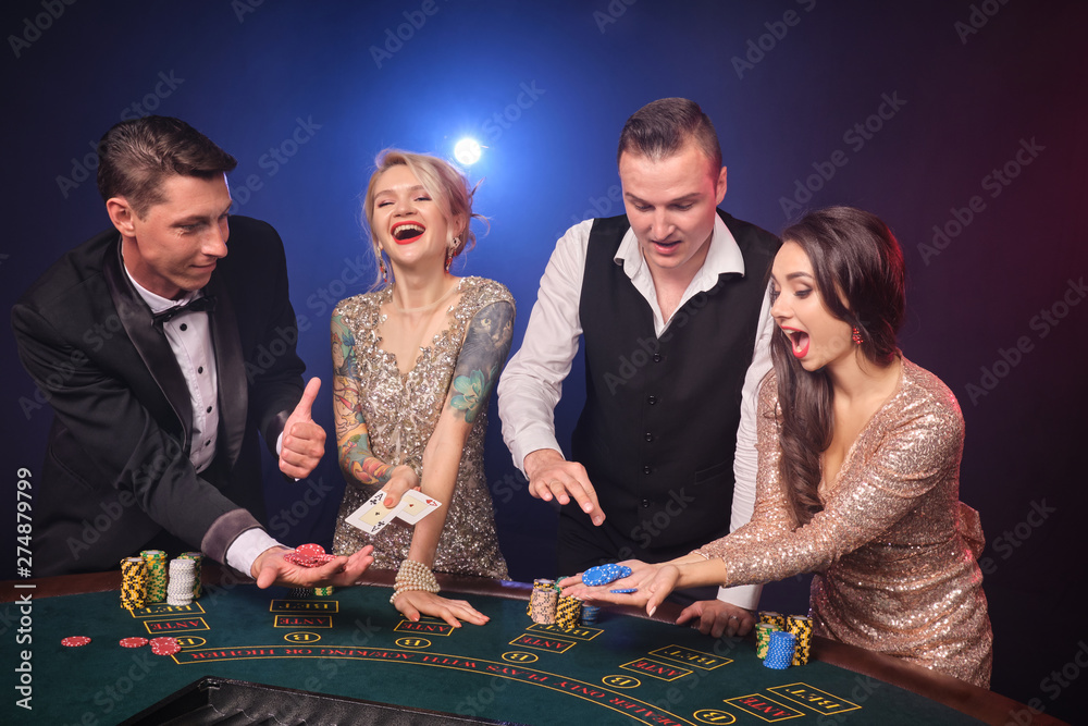 Group of a stylish rich friends are playing poker at casino. Group of a stylish rich friends are playing poker at casino.