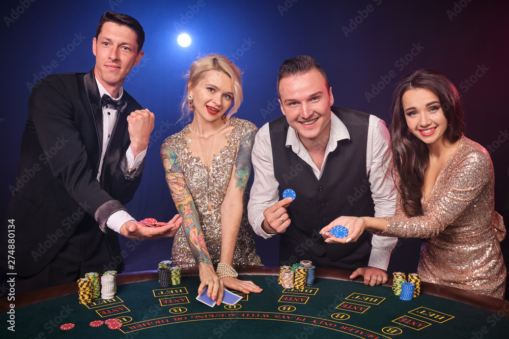 Group of a stylish rich friends are playing poker at casino. Group of a stylish rich friends are playing poker at casino.