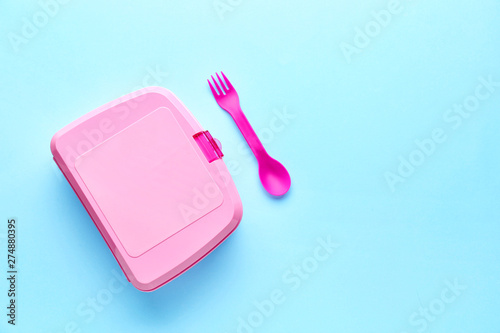 Plastic lunch box on color background photo