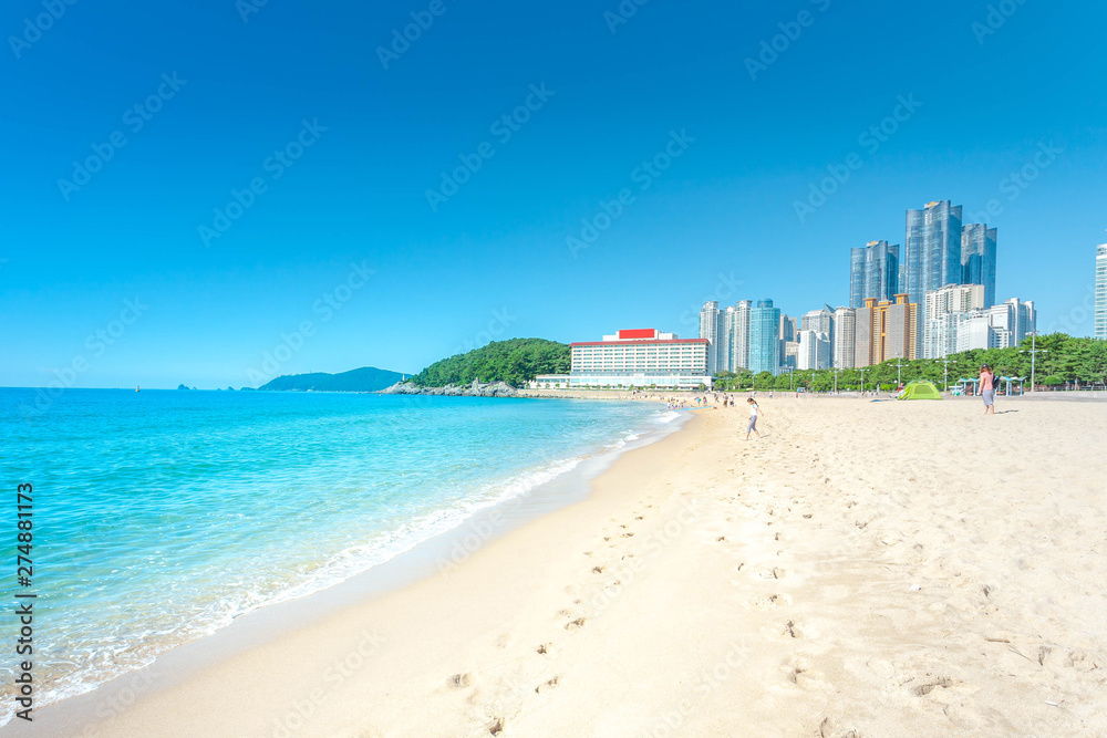 sea beach blue sky sand sun daylight relaxation landscape viewpoint in Haeundae beach in summer at Busan in Korea.
