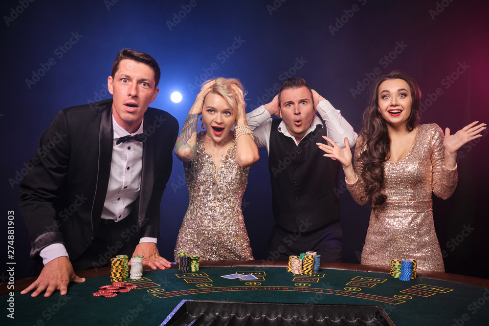 Group of a stylish rich friends are playing poker at casino. Group of a stylish rich friends are playing poker at casino.