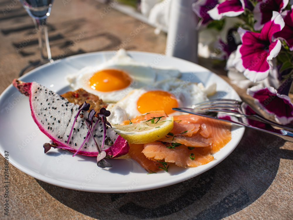 Elegant tasteful summer breakfast table outdoor.