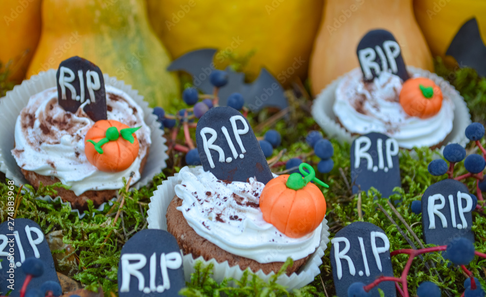 Happy Halloween Cupcakes.Halloween cookies.Composition for Halloween with sweets..Pumpkin, ghost, spider, gloom, moss, party, birthday