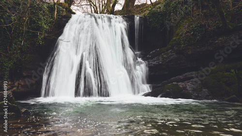 A waterfall at Janet's Foss near Malham in the Yorkshire Dales, England. photo