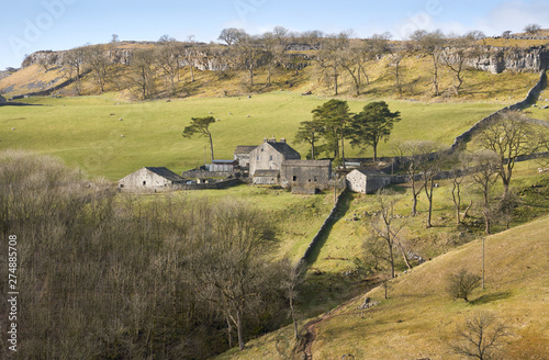 Views out over farmland and farm buildings near Horton in Ribblesdale, Yorkshire Dales. photo