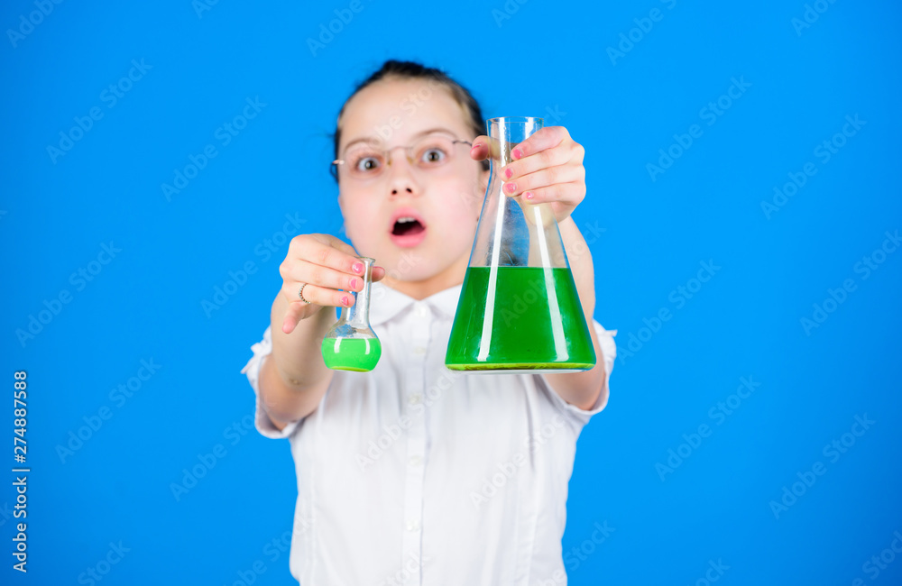 education and knowledge. back to school. child study bilogy lesson. small smart girl with testing flask. science research in lab. Small school girl. Confident at her researches education and knowledge. back to school. child study bilogy lesson. small smart girl with testing flask. science research in lab. Small school girl. Confident at her researches