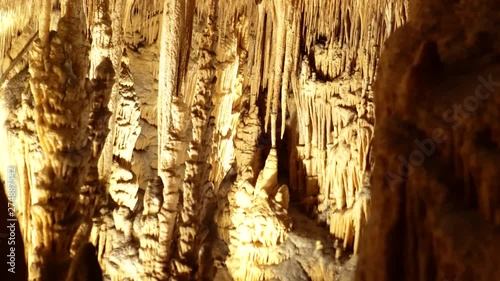 Dolly or track left of stalagtites and stalagmites in Drach Caves, Mallorca island, Spain photo