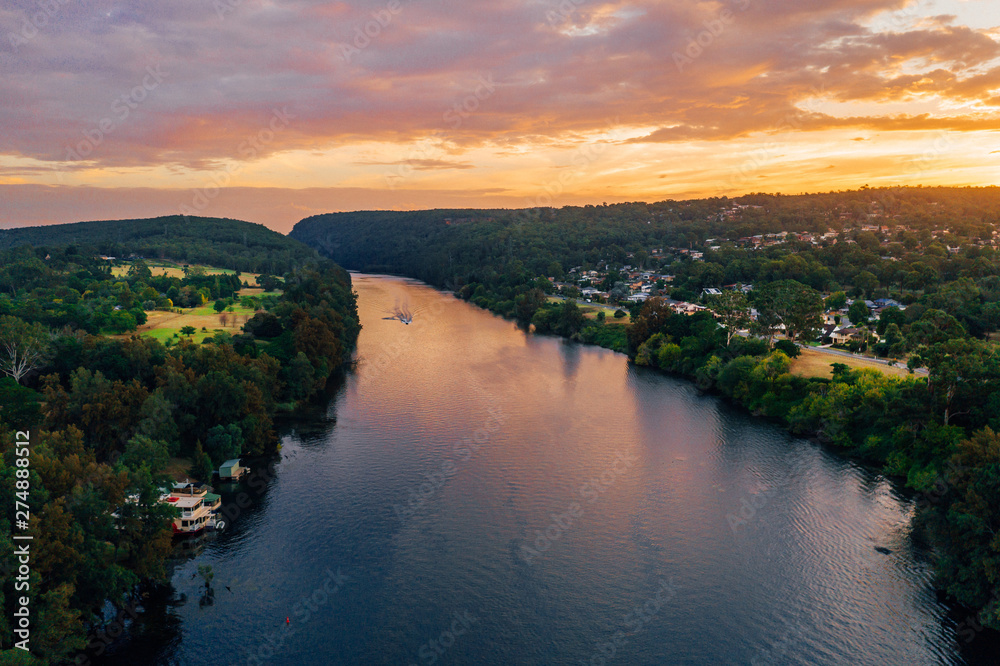 Speedboat on Nepean River at sunset