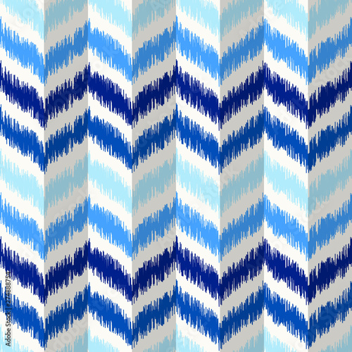 Uzbek ikat silk fabric pattern, indigo blue and white colors.