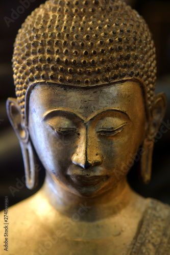 Wallpaper Mural The face of the golden Buddha statue in the temple Torontodigital.ca