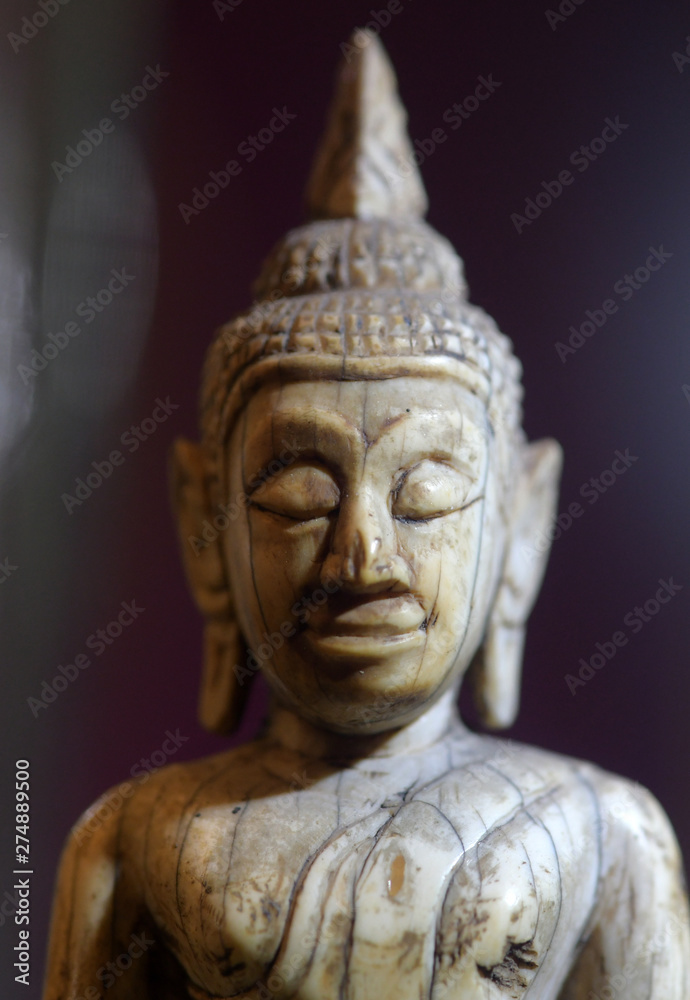 The face of the ancient Buddha image in the temple