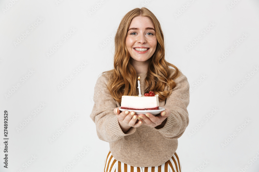 Attractive young girl wearing sweater standing isolated Attractive young girl wearing sweater standing isolated