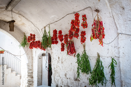 Tableau sur toile Typical old town house with peppers and tomato hung out to dry