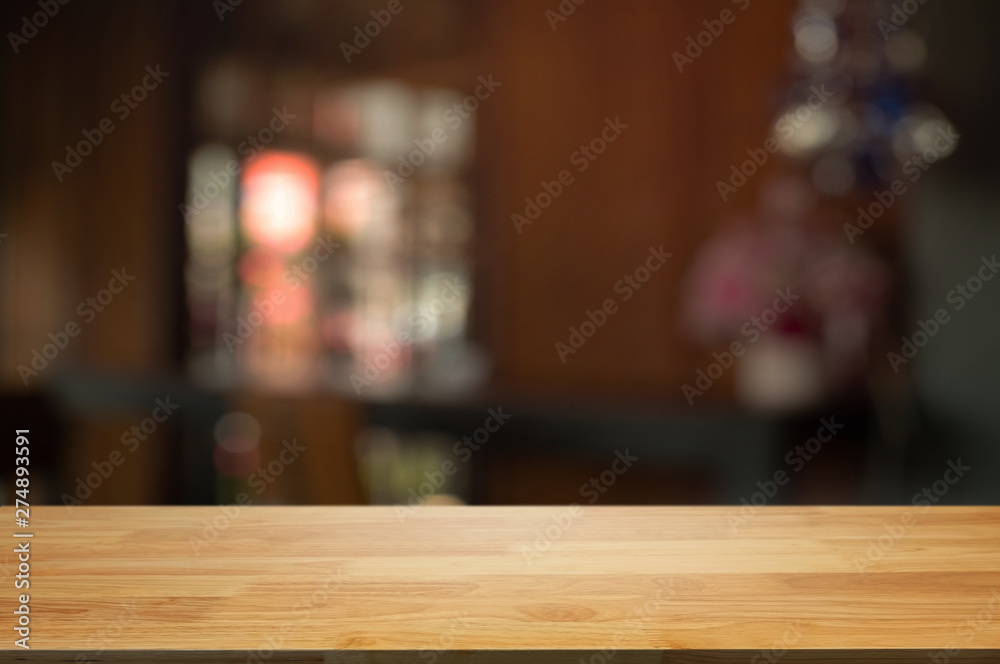empty wood table with blur montage restaurant background