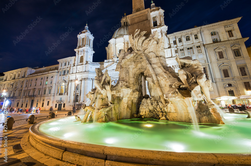 Fototapeta ROME, ITALY - JUNE 2014: Tourists visit Navona Square at dusk. The city attracts 15 million people annually