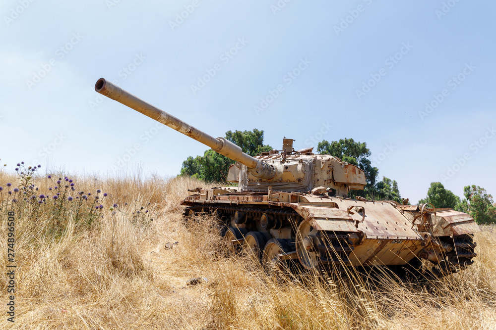 Fototapeta premium Destroyed Israeli tank is after the Doomsday (Yom Kippur War) on the Golan Heights in Israel, near the border with Syria