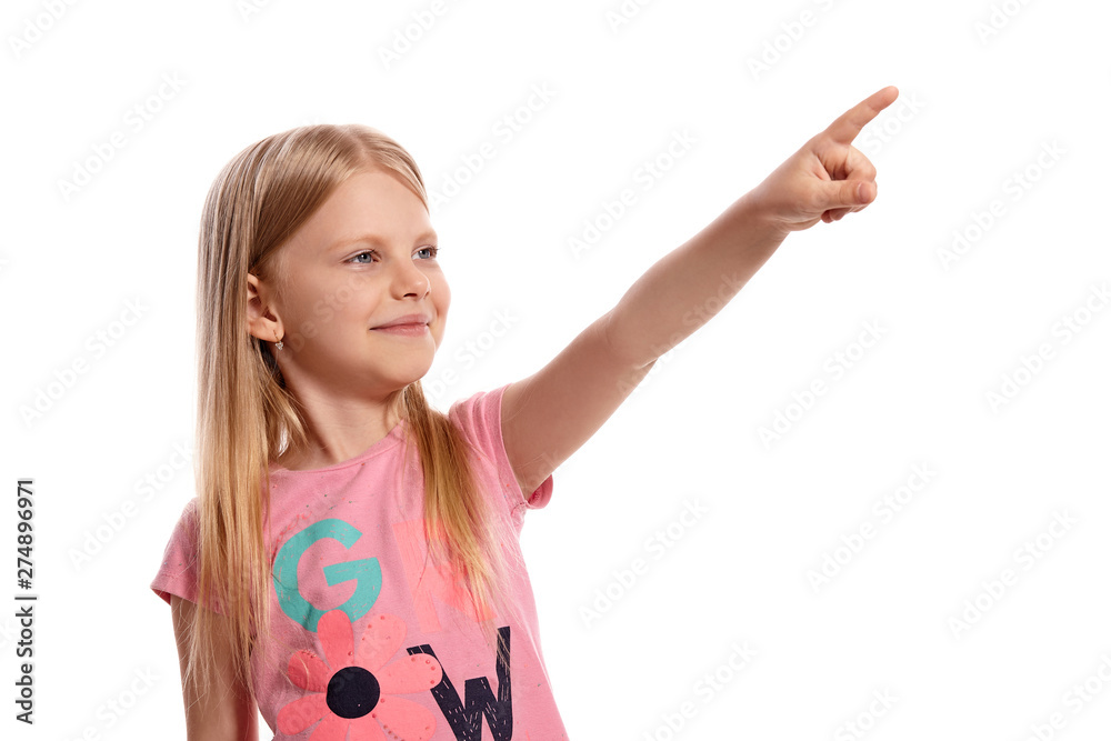 Close-up portrait of a nice blonde little kid in a pink t-shirt posing isolated on white background. Close-up portrait of a nice blonde little kid in a pink t-shirt posing isolated on white background.
