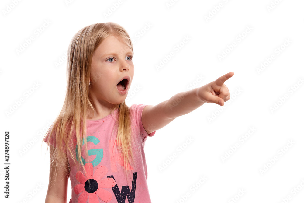 Close-up portrait of a nice blonde little kid in a pink t-shirt posing isolated on white background. Close-up portrait of a nice blonde little kid in a pink t-shirt posing isolated on white background.