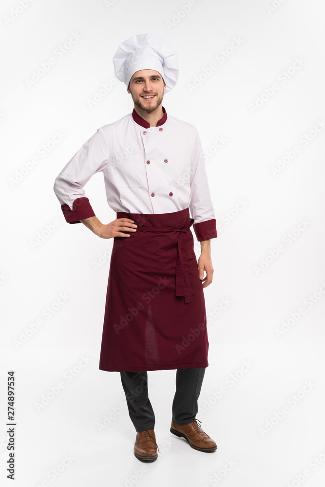 Positive handsome chef cook in beret and white outfit isolated on white background. Positive handsome chef cook in beret and white outfit isolated on white background.
