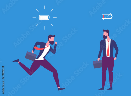 Energetic and tired businessman with full charge and uncharged battery business concept