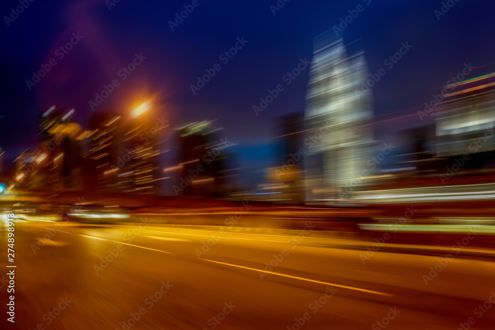 Night streets of modern building background, with speed motion effect applied
